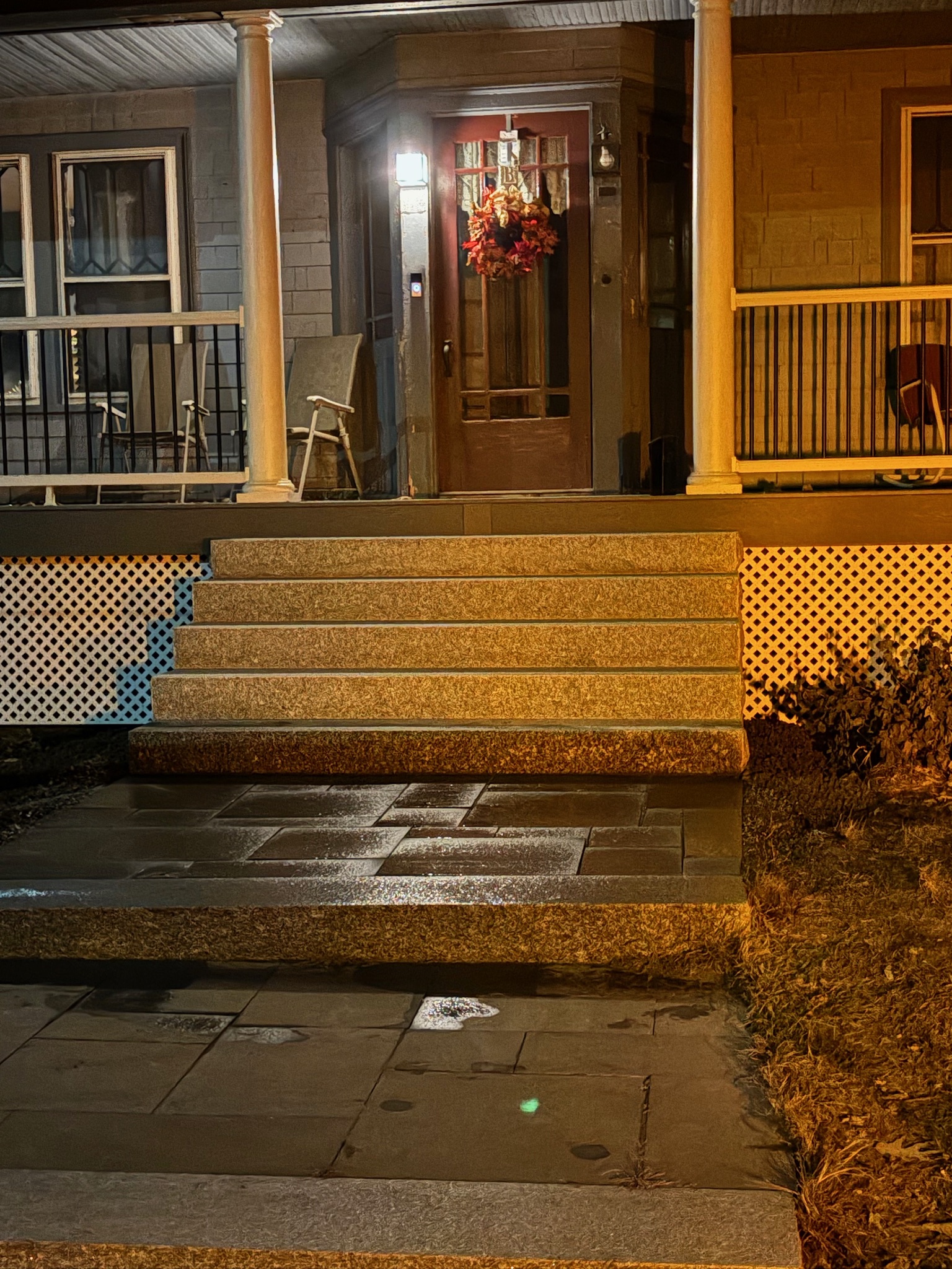 granite steps to a well appointed entryway